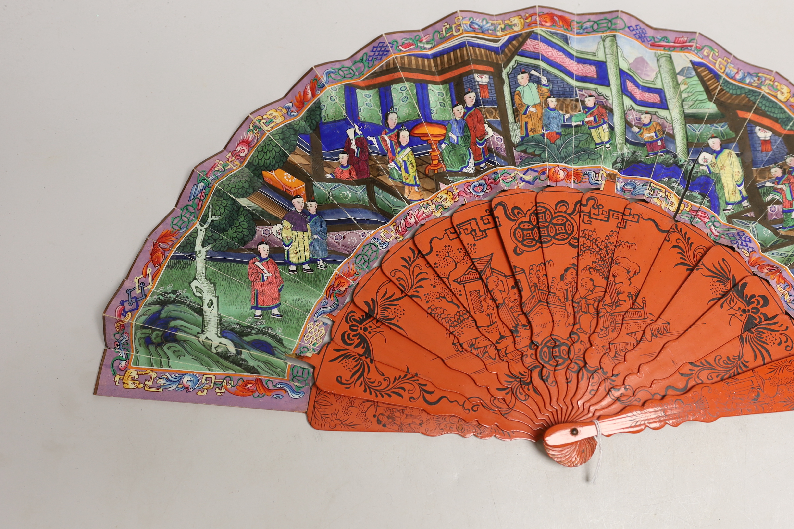 A Chinese hand painted figural fan with applied ivory faces and red lacquered guards, and boxed both damaged CITES Submission reference ERW33PQG